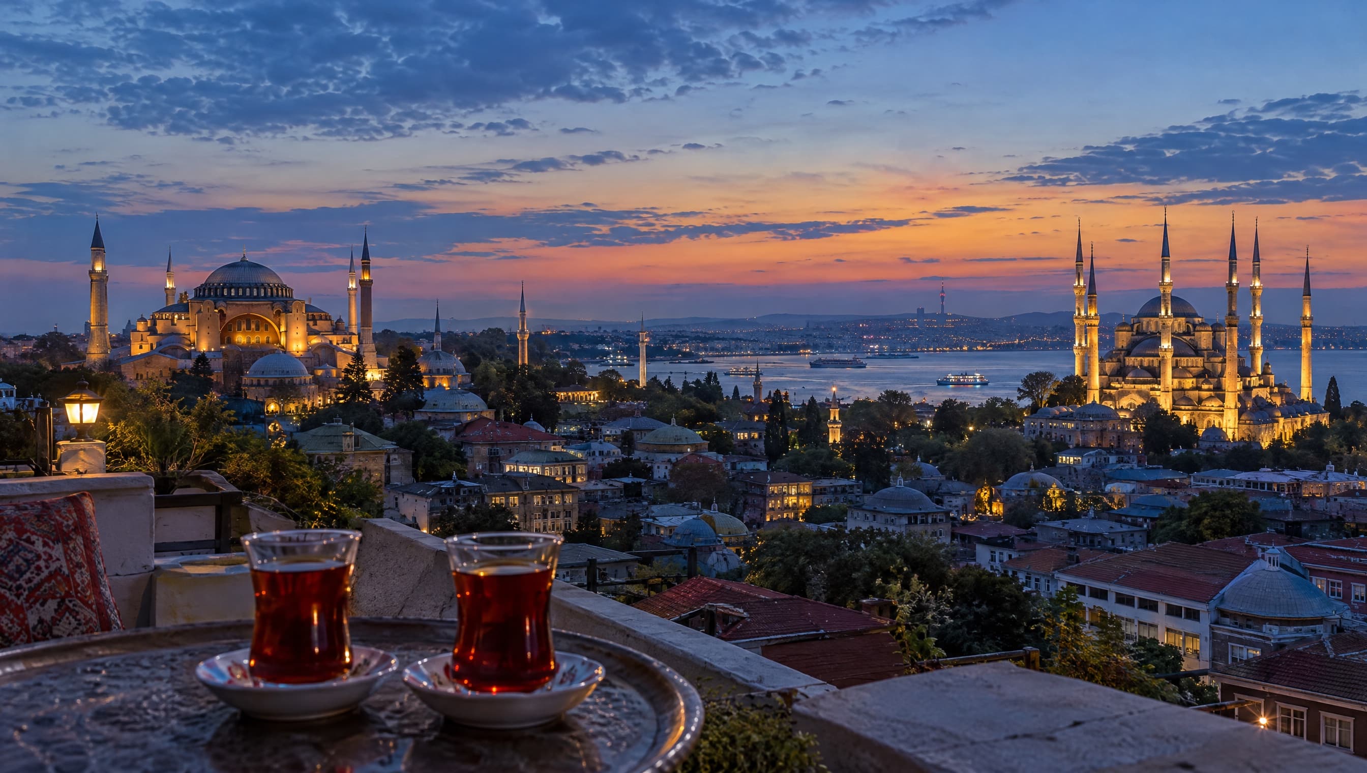 Turkish tea on a rooftop overlooking Hagia Sophia and the Blue Mosque at dusk